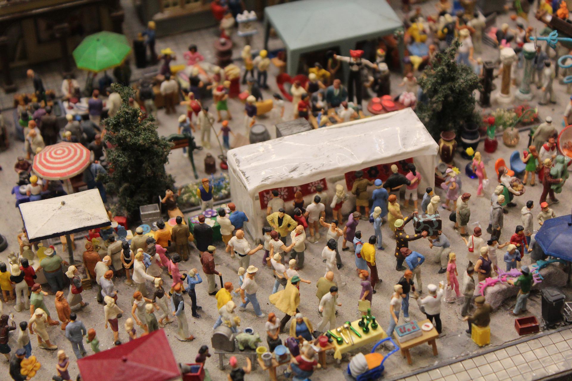 A collection of miniatures on part of a model railway layout