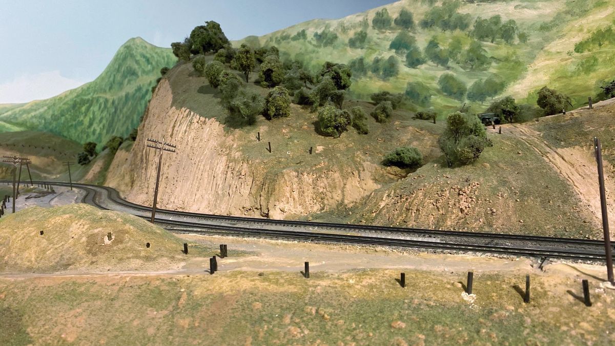 Hills on a model train layout built using a papier mache recipe